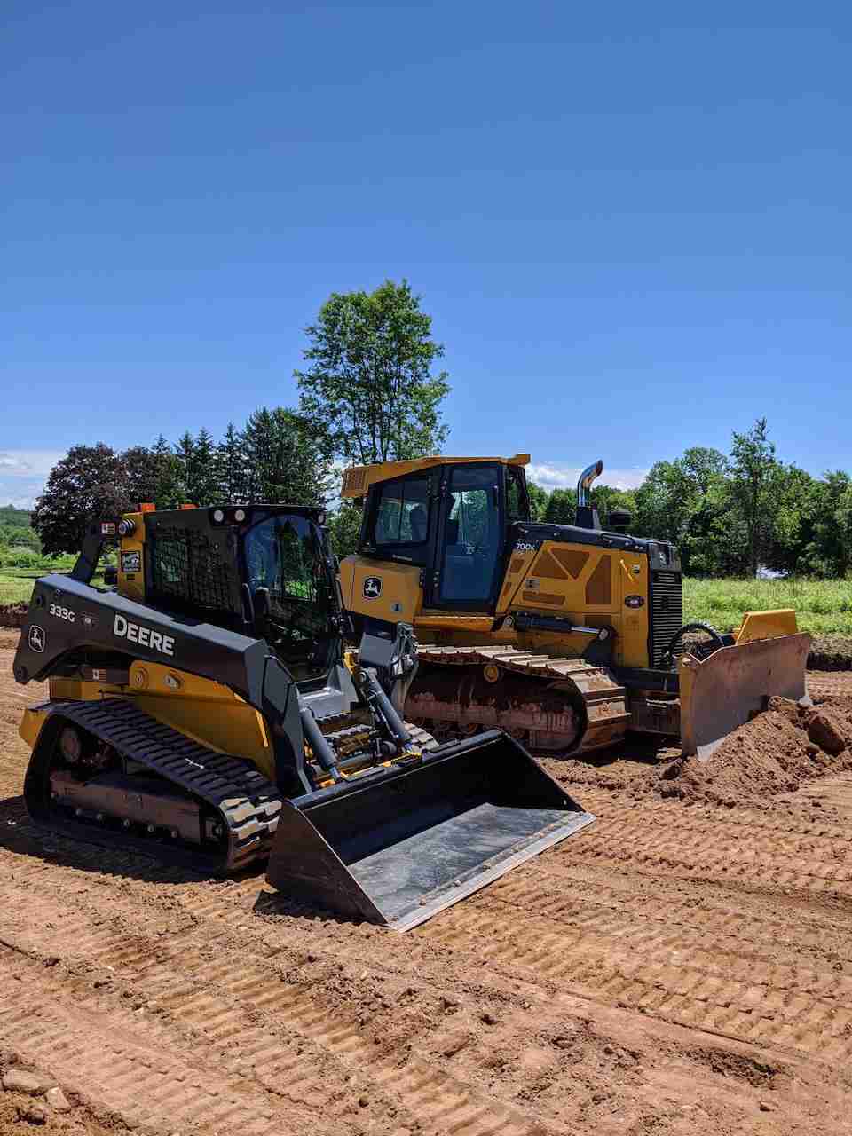 Hazelwood Inc on a job site with their John Deere bulldozer and compact trackloader. Leading the New Haven County, CT in site work.